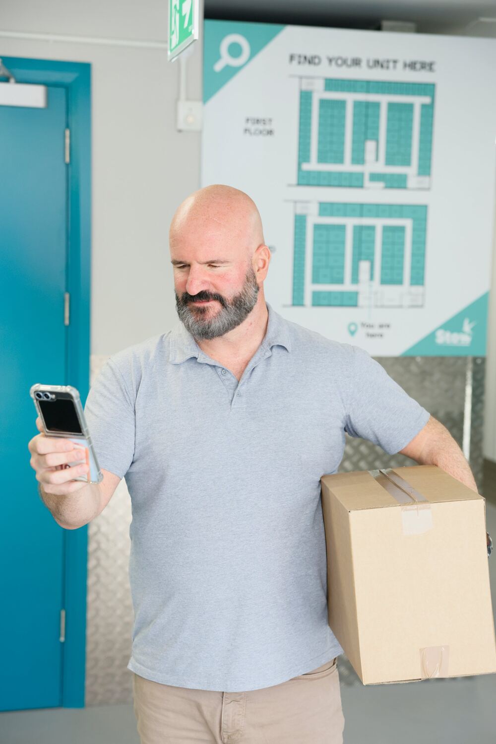 Opening a storage unit with the Stow app Customer using the Stow app on his smartphone to access his storage unit